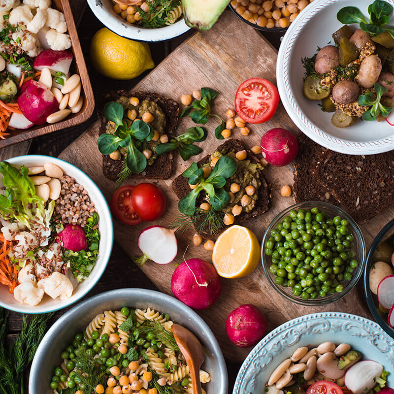 An array of pasta, beans and vegetable dishes.