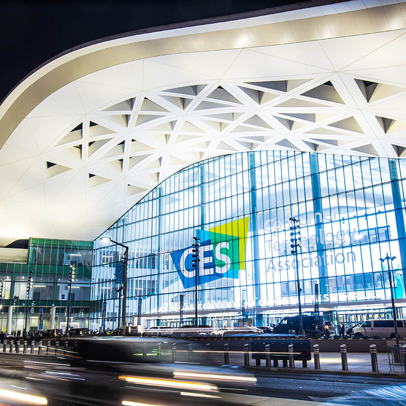 CES event venue with large windows and CES logo.